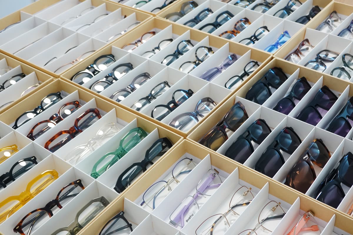 Sample trays packed with eyewear: acetate opticals, metal frames and sunglasses in divided boxes